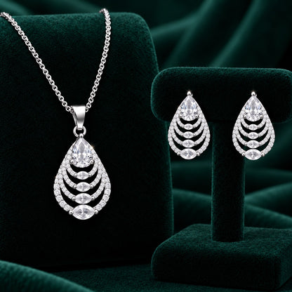 Clear zircon Cascade Leaf pendant and matching earrings in polished silver tone.