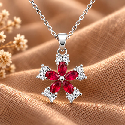Fleur Quintet Locket with rich ruby-red marquise stones surrounded by clear zircon accents.