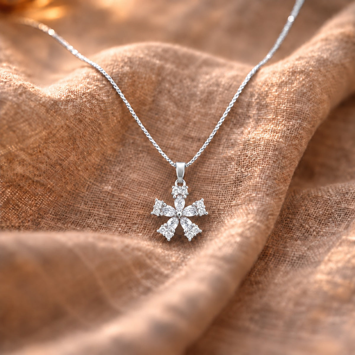 Fleur Quintet Locket featuring clear marquise-cut stones with brilliant clear zircon clusters and a polished silver finish.