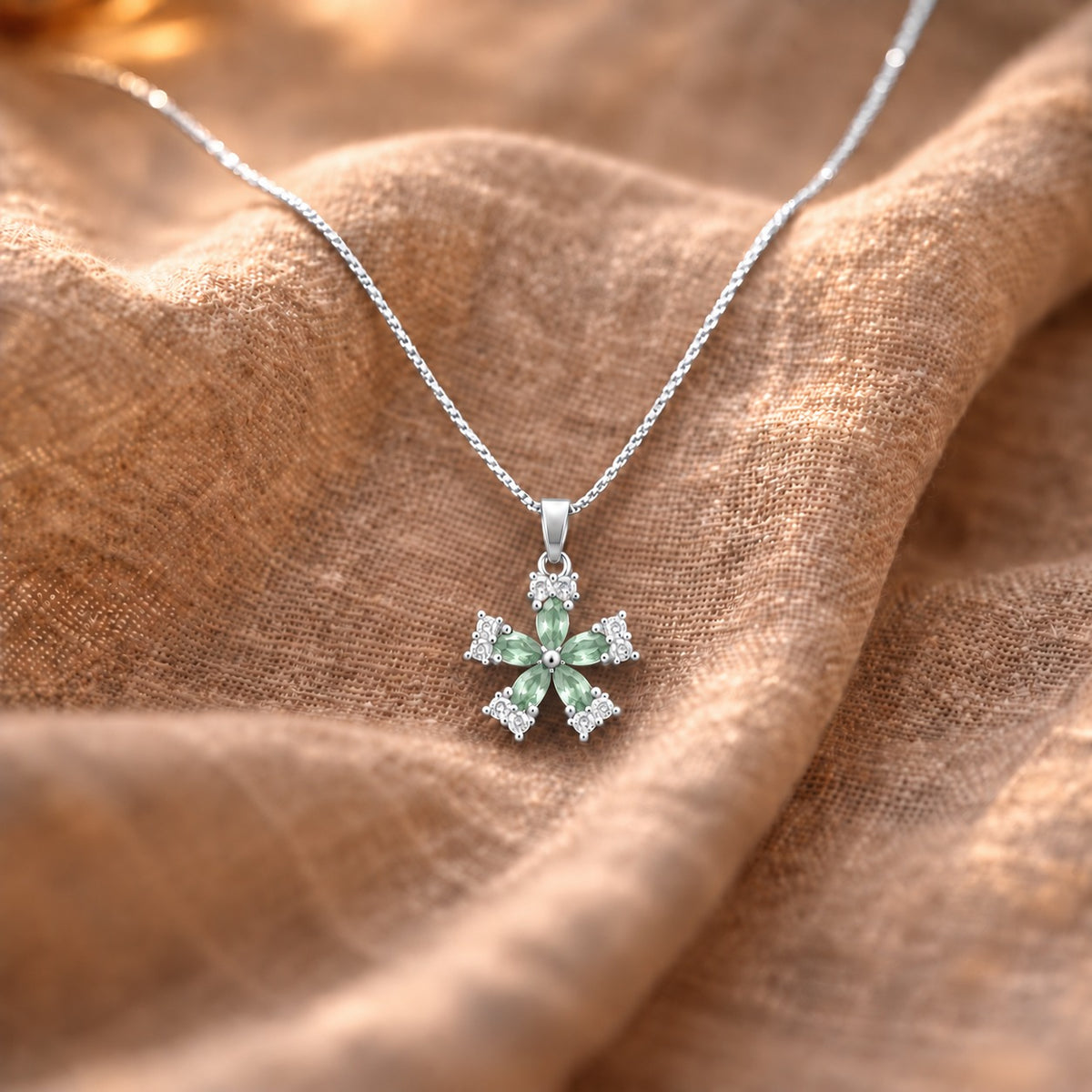 Fleur Quintet Locket with fresh mint-green marquise stones and clear zircon detailing in a silver-tone setting.