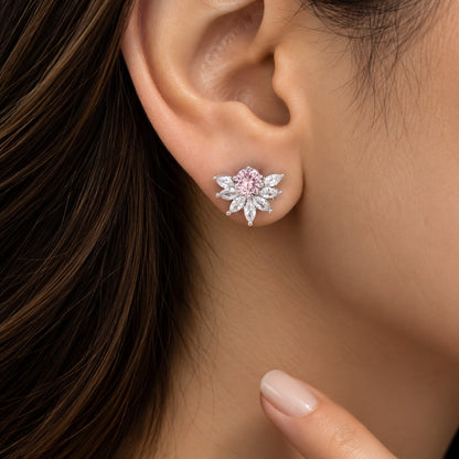 Model wearing Trillium Gem Petal Studs featuring a round coloured centre stone surrounded by clear marquise zircon petals.