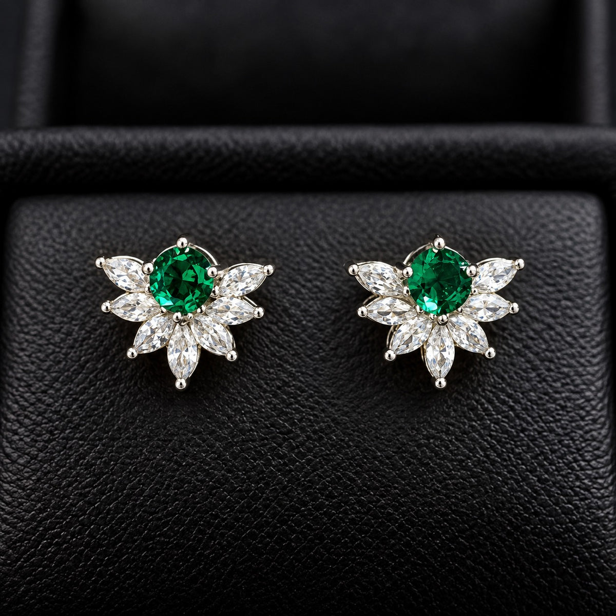 Trillium Gem Petal Studs with marquise clear zircon petals and round emerald green centre gemstone in silver-tone setting.
