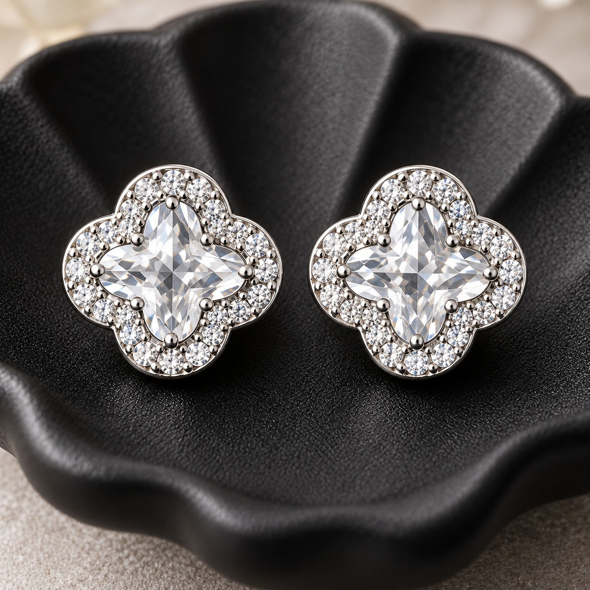 Close-up of Crystal Quatrefoil S925 Studs featuring a four-point clear crystal surrounded by finely set zircon.