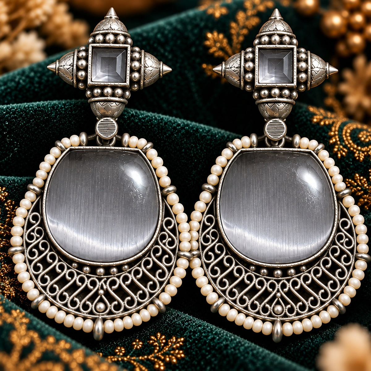 The Ancestral Crest Drops in Mist Grey with antique silver filigree and pearl detailing.