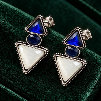 Sapphire blue and ivory Legacy Trine Earrings with opposing triangular stones, oval centre and silver-tone beaded setting.