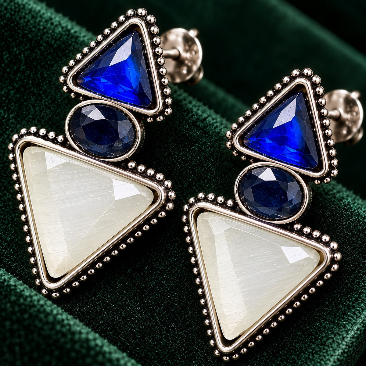 Sapphire blue and ivory Legacy Trine Earrings with opposing triangular stones, oval centre and silver-tone beaded setting.