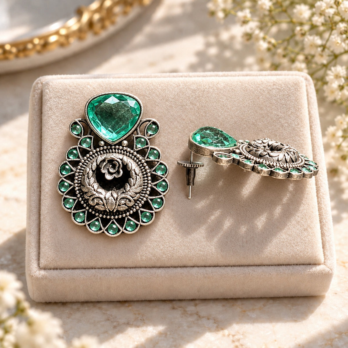 Side view of The Courtyard Rose Earrings showing the raised construction, teardrop stone setting and post fastening.