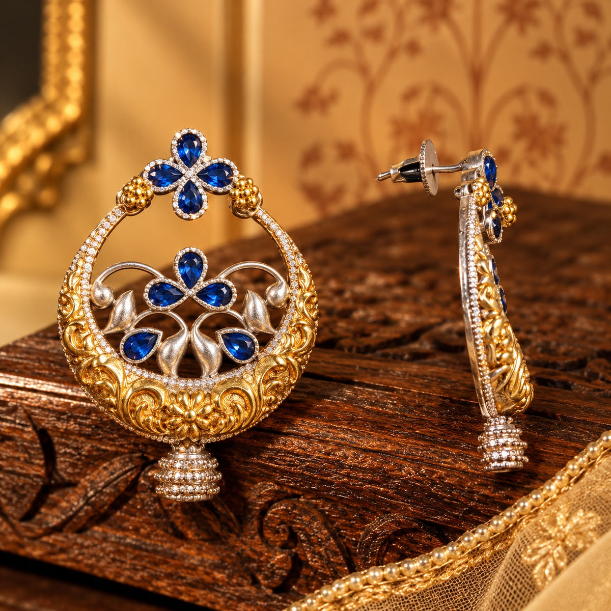 Side view of Azure Courtyard Earrings showing the dimensional circular structure, detailed metalwork and post-back fastening.