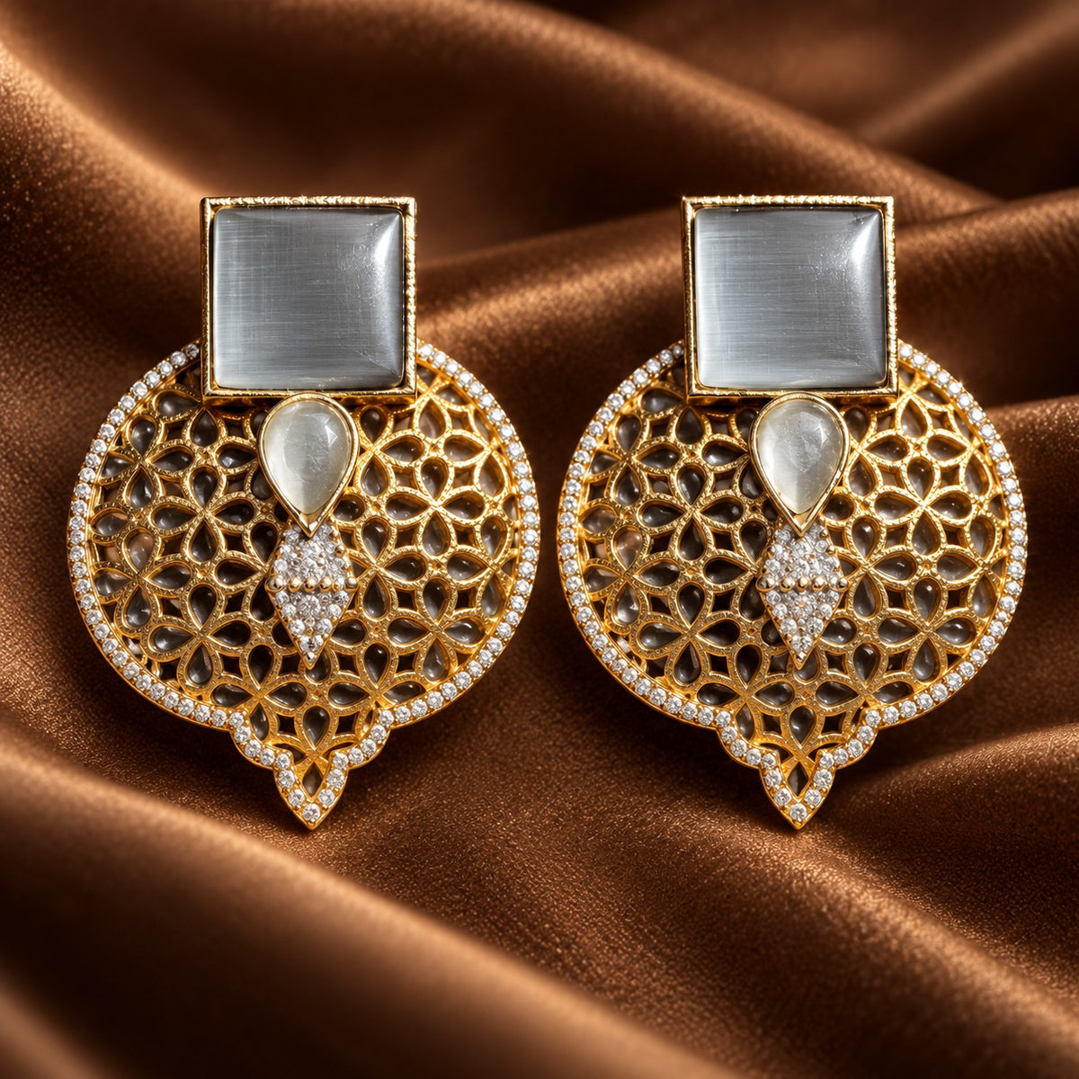 silver grey Sovereign Court Earrings featuring contrasting geometric stones, ornate gold-tone detailing and a clear zircon-edged frame