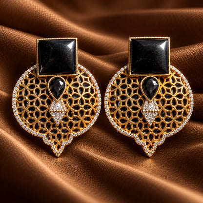 Onyx Black Sovereign Court Earrings featuring contrasting geometric stones, ornate gold-tone detailing and a clear zircon-edged frame