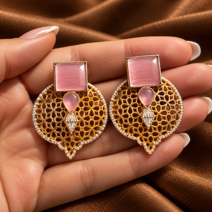 Hand-held close-up of Sovereign Court Earrings highlighting the geometric stones, detailed open latticework and clear zircon border.
