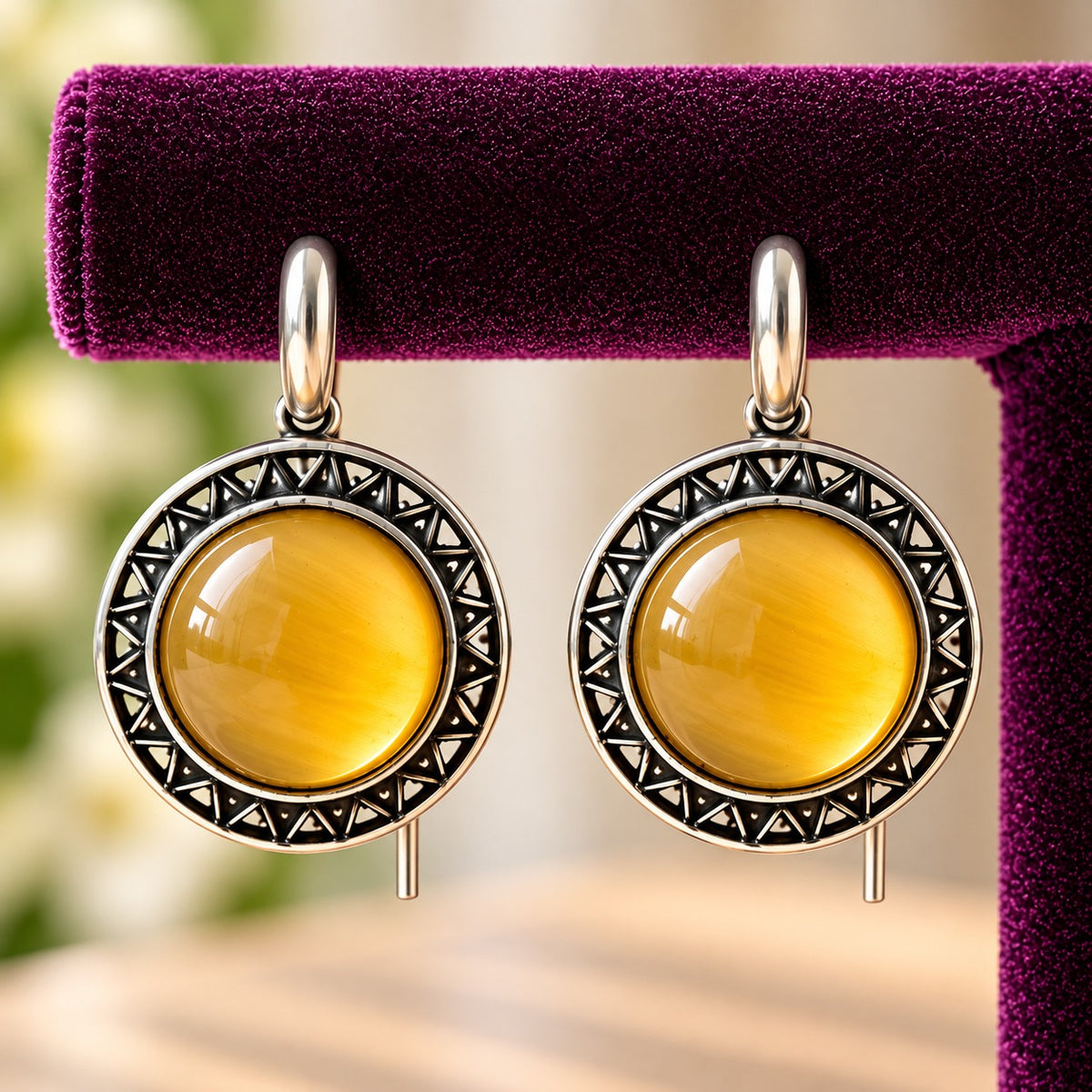 Close-up of Golden Amber Ottoman Round Earrings showing smooth domed stones and intricate geometric antique-metal detailing.