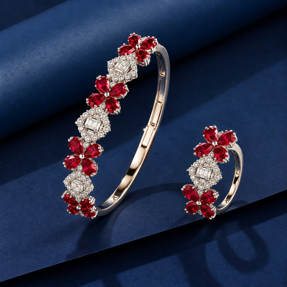 Ruby red floral gemstone bracelet and matching ring featuring silver-tone settings, four-petal motifs and clear zircon detailing.