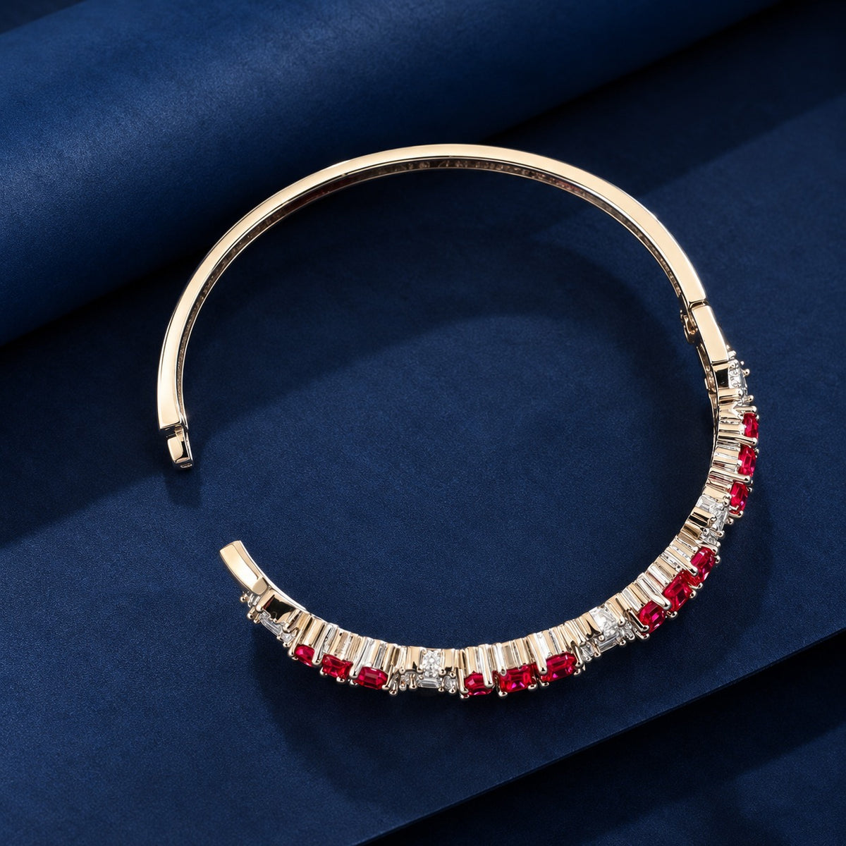 Reverse view of the floral gemstone bracelet showing its polished metal structure, open bangle design and gemstone settings.