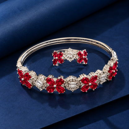Detailed close-up of the matching floral bracelet and ring highlighting pear-cut gemstone petals, baguette-cut clear stones and intricate zircon borders.