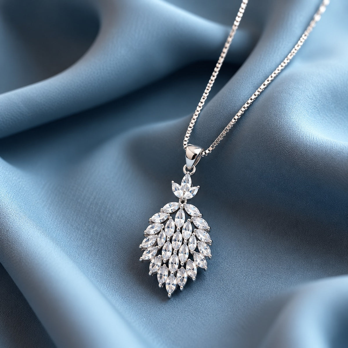 Cascade Willow Zircon Pendant featuring clear marquise-cut zircon stones arranged in a cascading leaf design with a polished silver-tone finish.