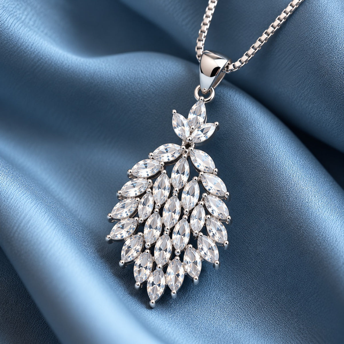 Detailed close-up of the Cascade Willow Zircon Pendant showcasing its layered marquise-cut zircon stones, polished silver-tone setting, and leaf-inspired silhouette.