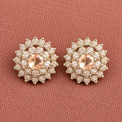 Detailed close-up of Aqua champagne Kensington Cluster Studs highlighting the faceted mint-green centre stones, intricate circular arrangement and surrounding clear zircon detailing.