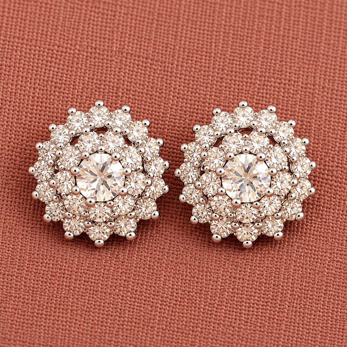 Detailed close-up of  clear Kensington Cluster Studs highlighting the faceted mint-green centre stones, intricate circular arrangement and surrounding clear zircon detailing.