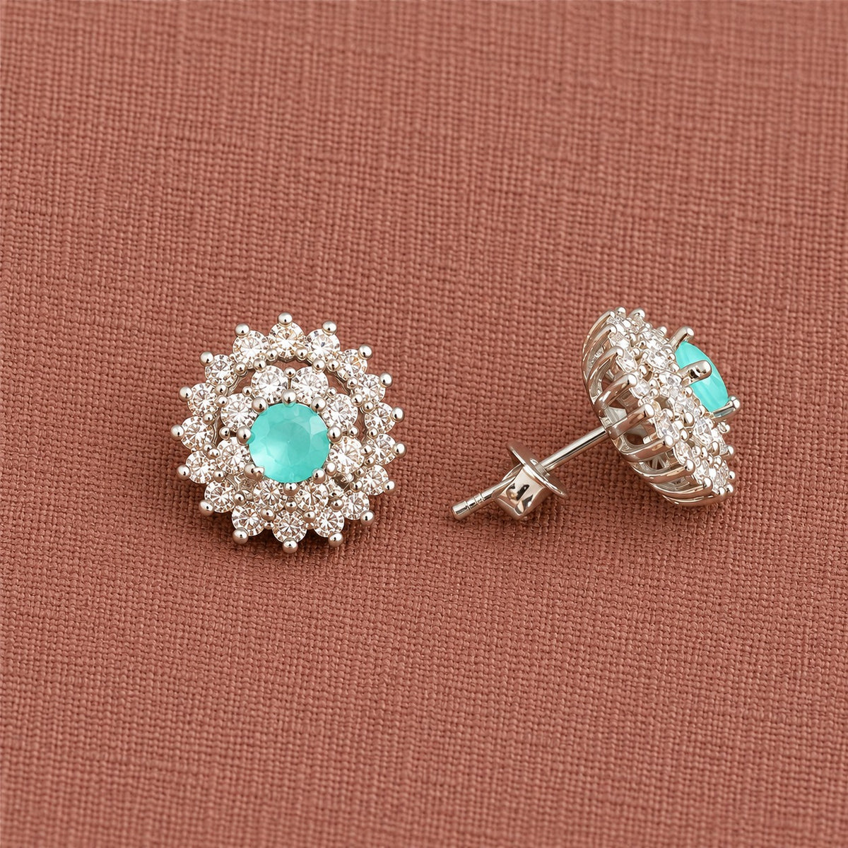Side-angle view of Aqua Mint Kensington Cluster Studs displaying the raised centre stone, layered zircon setting, detailed metal framework and stud post.