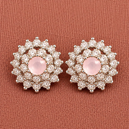 Detailed close-up of soft  pink Kensington Cluster Studs highlighting the faceted mint-green centre stones, intricate circular arrangement and surrounding clear zircon detailing.