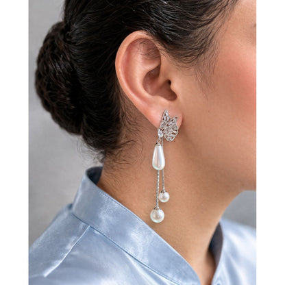 Silver butterfly pearl drop earrings with chain back stopper worn on ear side profile with silk shirt
