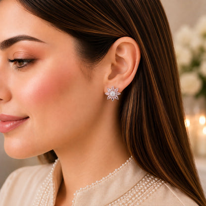 Floral crystal stud earring worn on model showing compact flower design, marquise-cut petals and clear centre crystal