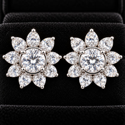  Close up of Solaris Crest Stud earrings with round clear zircon centre stones and radiating marquise-cut zircon detailing, displayed on a black jewellery surface.