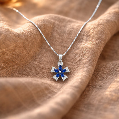 Fleur Quintet Locket featuring deep sapphire-blue marquise stones with clear zircon clusters.