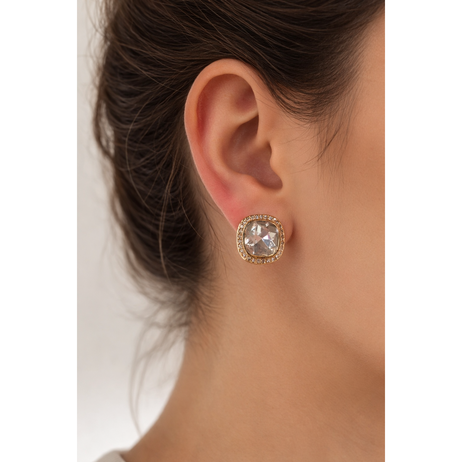 Gold cushion-cut champagne crystal stud earring worn on female model showing fit and size.