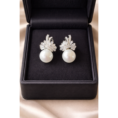 TIAS pearl drop earrings with crystal detailing in silver finish displayed inside a black jewellery box.”