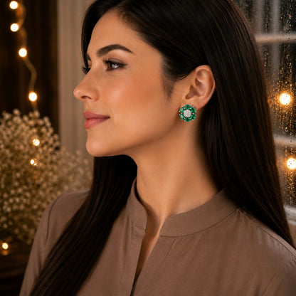 Woman wearing elegant floral  green crystal stud earrings with marquise-cut gemstone petals and a sparkling pavé center in a luxury side-profile portrait.